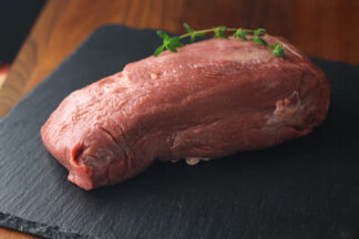 Beef Ox Tongue displayed on butchers slate
