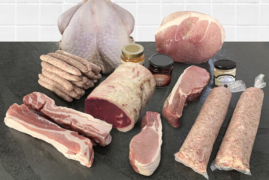 Products on butchers slate for ultimate indulgent hamper